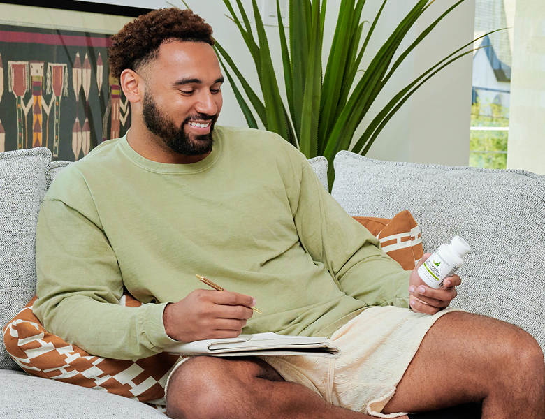 Man with MassZymes bottle