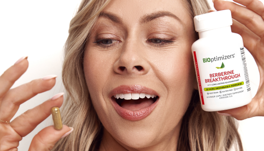 Woman holding Berberine Breakthrough bottle