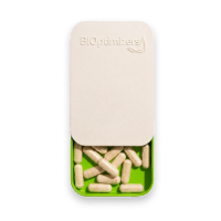 BiOptimizers pill container with capsules