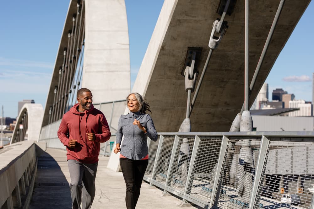 Active couple in their 50's jogging